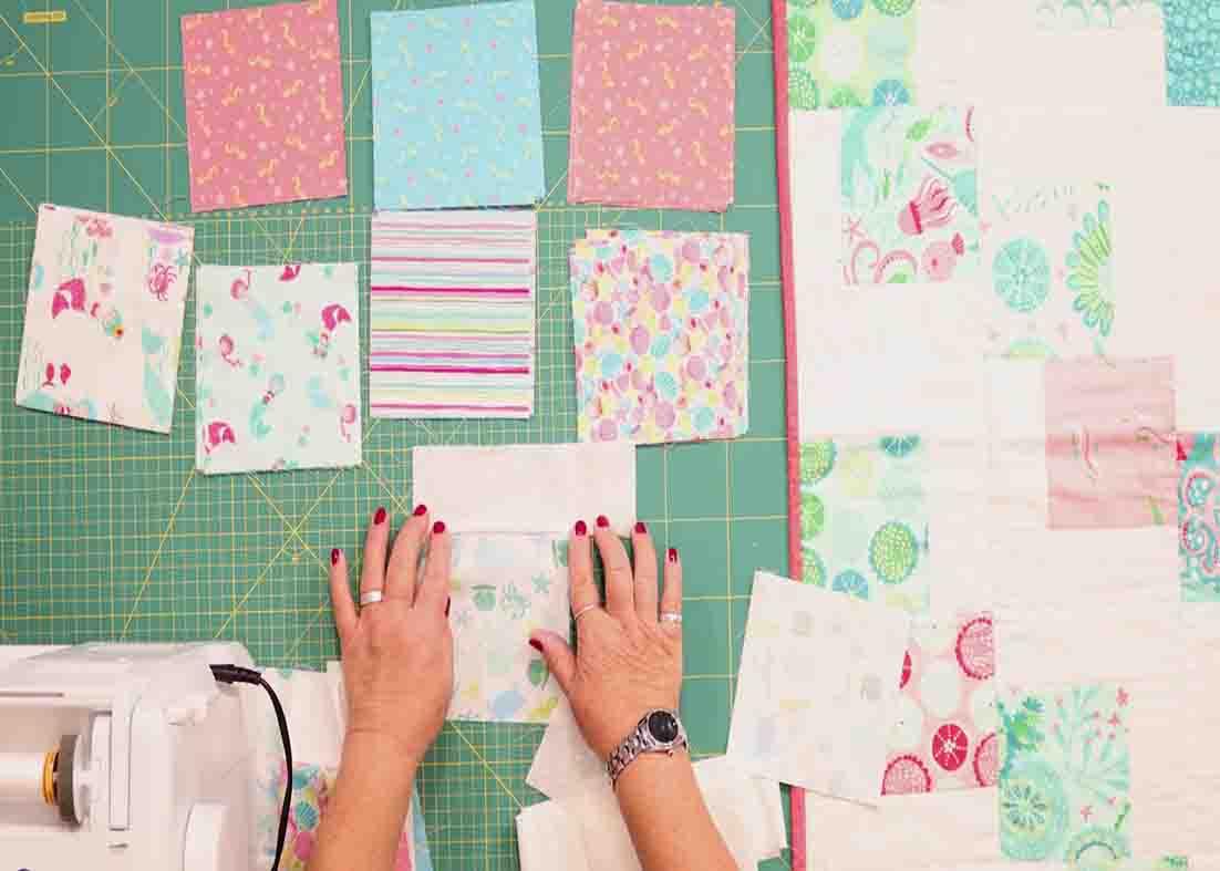 Joining the strips and squares to make the block for the tumbling charms quilt