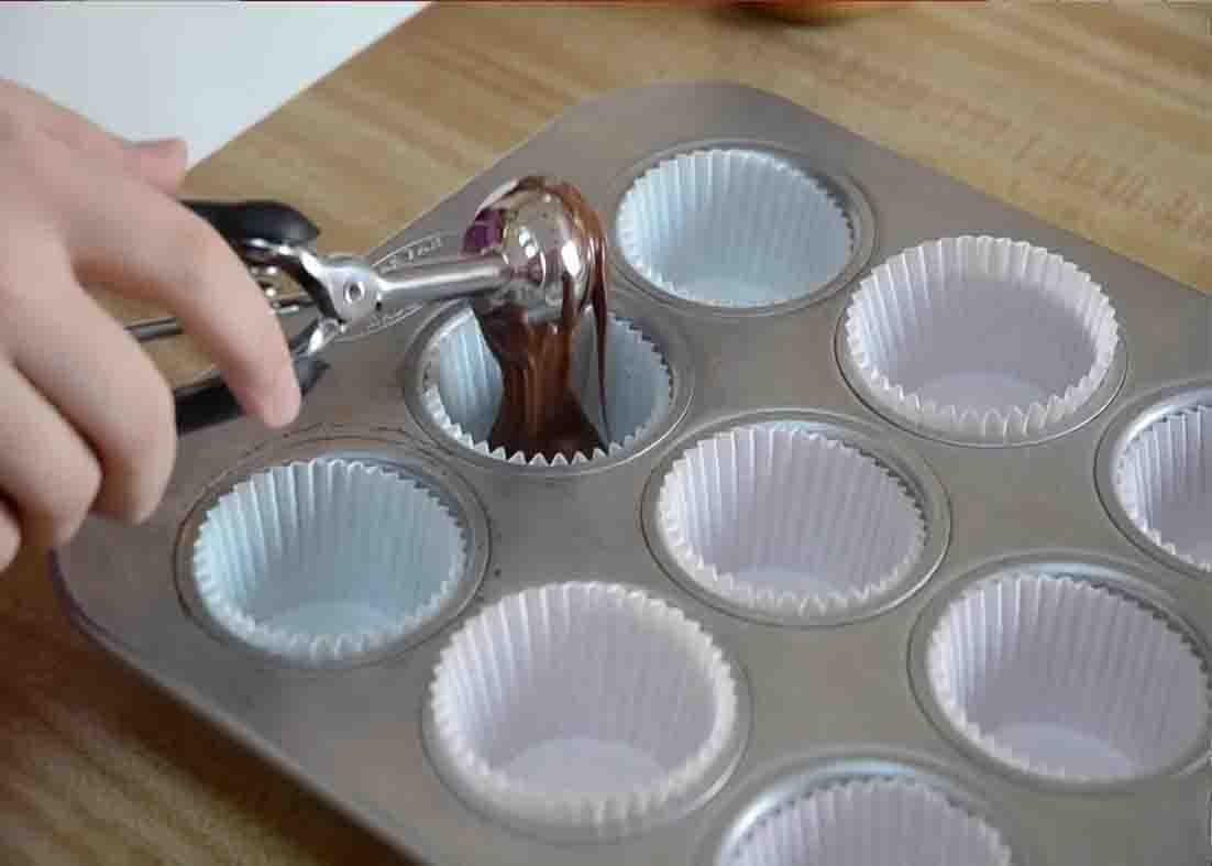 Layering the chocolate for the Reese's cup recipe