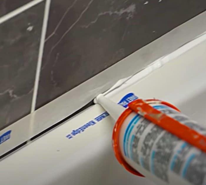 Apply tape in two layers before you caulk