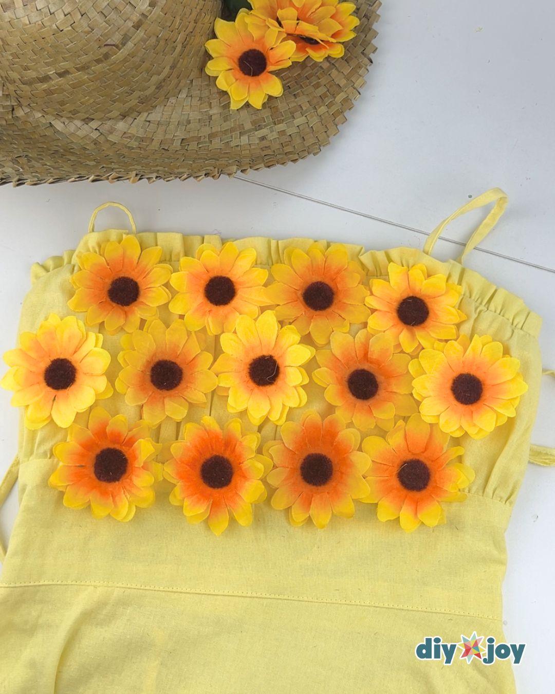 Couples Costume Sunflower And Gardener - diy sunflower costume with about twelve flower heads glued in three tight rows.