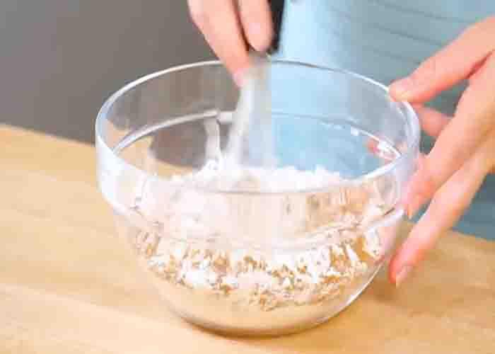 Combining the flour for the pumpkin spice bread