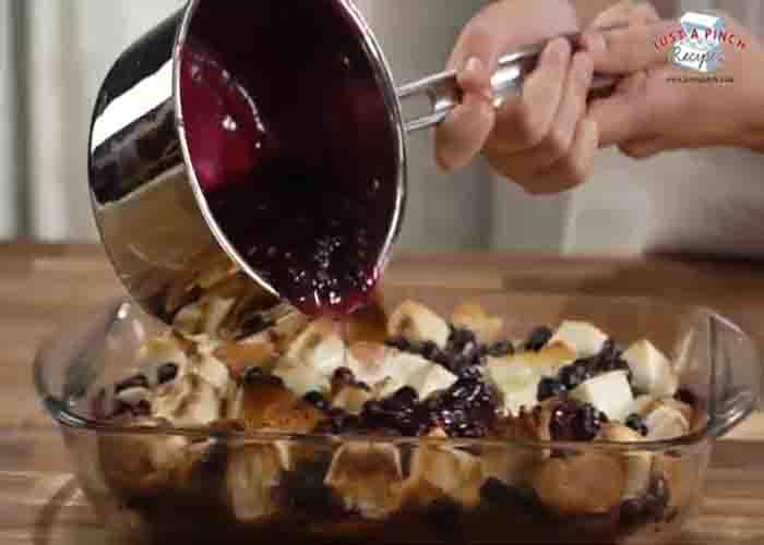 Assembling the blueberry French toast casserole