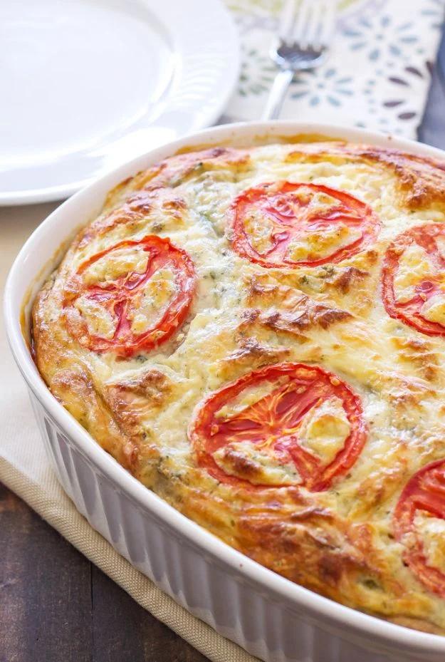 Crustless vegetable quiche with broccoli, red pepper and cheddar, sliced in a glass pie plate for brunch