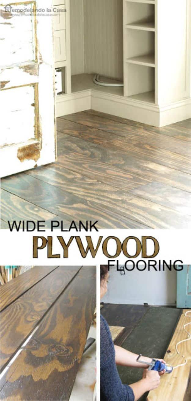 DIY plywood floors, dark stained wide plywood planks in a bedroom doorway, shown with staining and gluing steps