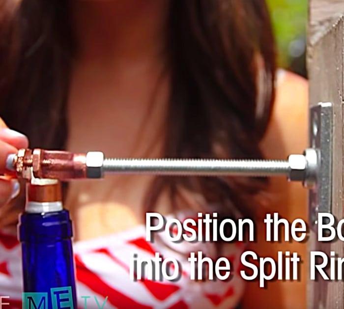 DIY Tiki Torch for a party in the backyard with recycled wine bottles
