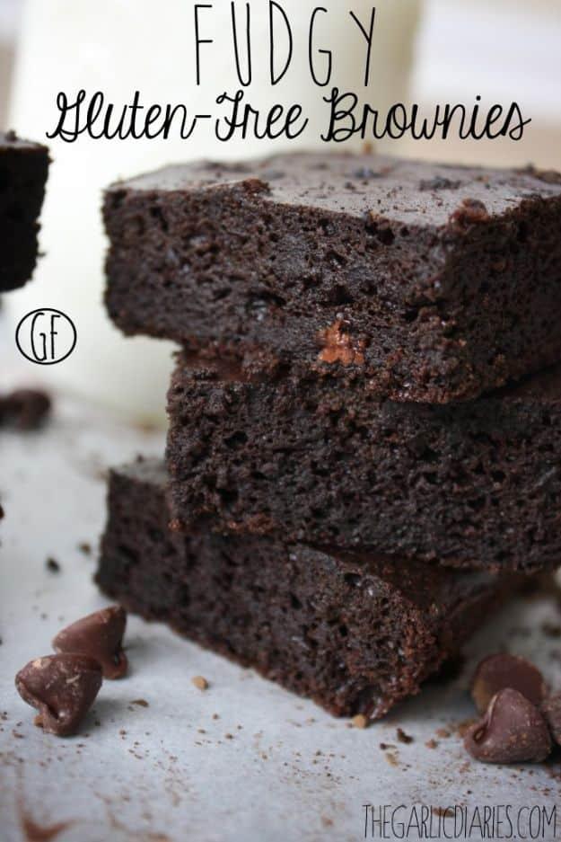 Fudgy gluten free brownies made with pureed black beans, cut into squares with a dense dark crumb inside