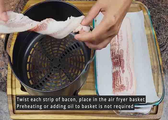 Twisting the bacon and placing them in the air fryer