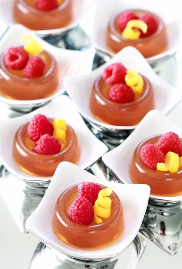 French 75 jello shots, pale gold cubes set from gin, lemon and champagne, plated up for a New Year's party