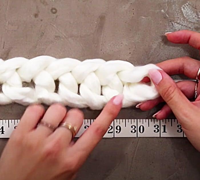 Make A Chain Stitch To Start A Chunky Baby Blanket - Easy DIY Baby Blanket - Finger-Knitting Ideas