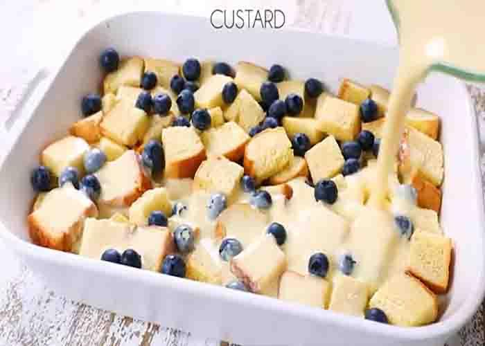 Assembling the blueberry french toast casserole