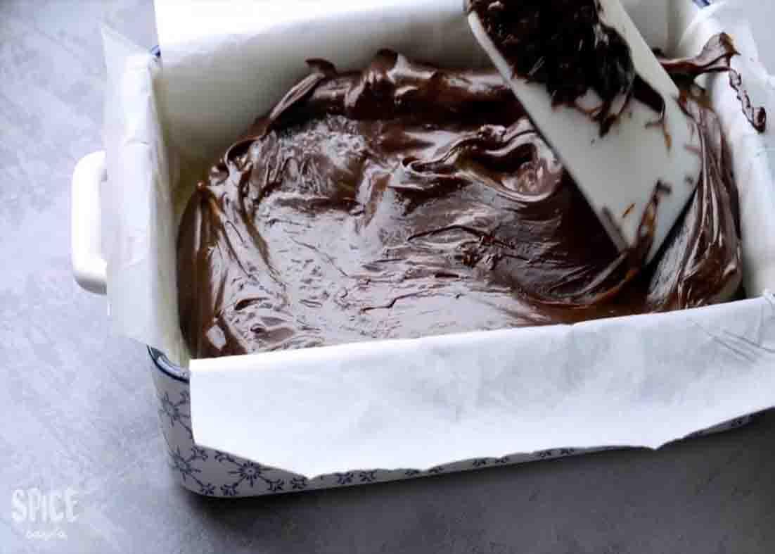 Spreading the chocolate mixture into the pan evenly