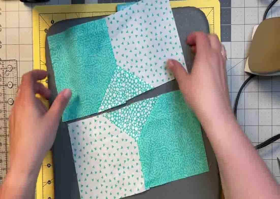 Sewing the blocks together to create the bow tie quilt