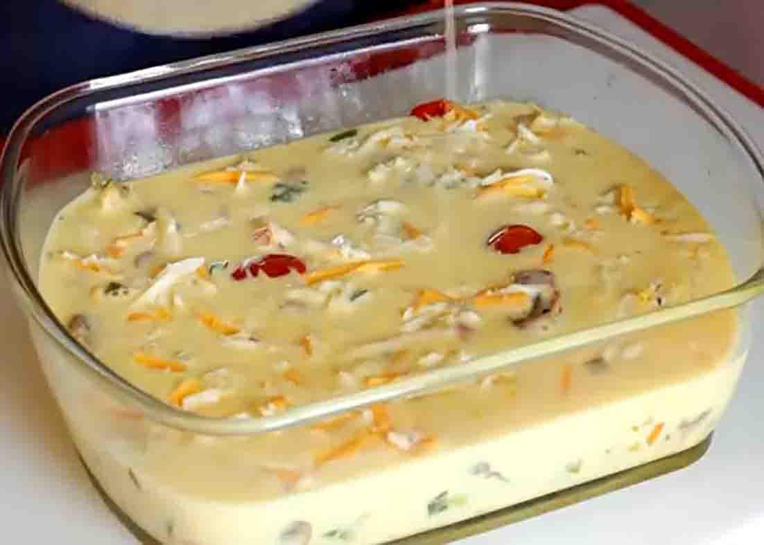 Pouring the egg mixture into the greased baking dish