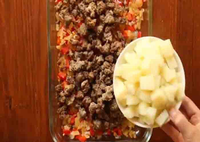 Assembling the breakfast casserole