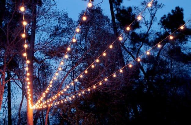 DIY String Lights Canopy, a budget friendly way to dress up a porch and a cozy touch for outdoor entertaining