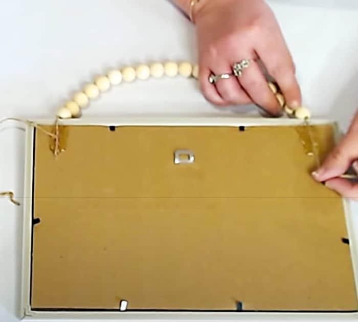 String Wooden Beads On Twine To Hang A DIY Magnet Sign