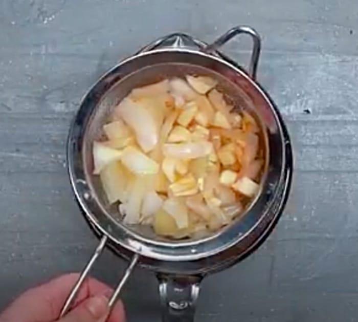 Make homemade pesticide with garlic, onions, and cayenne