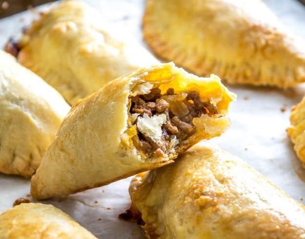 Spicy beef and cheese empanadas with golden flaky pastry and a chipotle seasoned ground beef filling