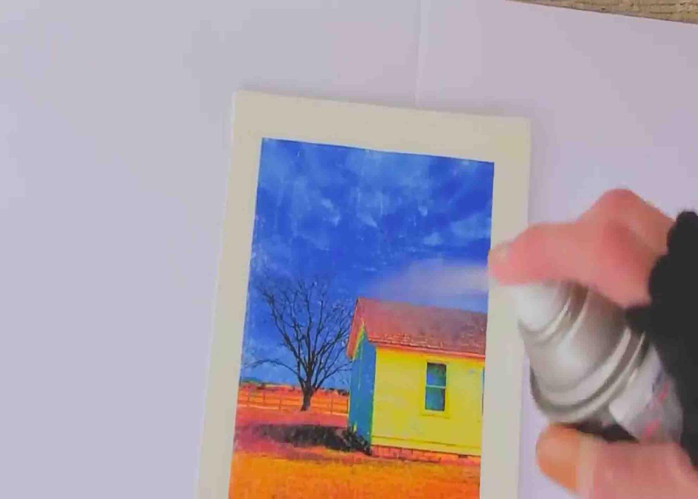 Spraying the photo with some acrylic spray