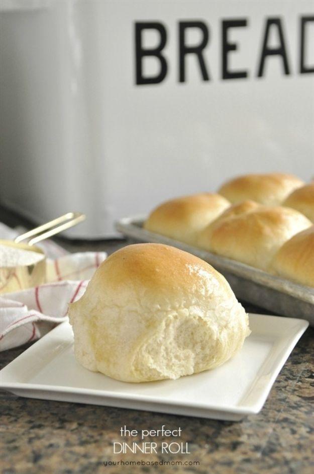 Perfect homemade dinner rolls baked side by side in a pan with soft golden tops brushed with melted butter