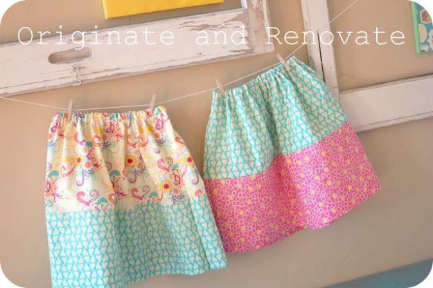 Two fat quarter toddler skirts, one cream floral with an aqua band and one aqua with a pink band, on a line