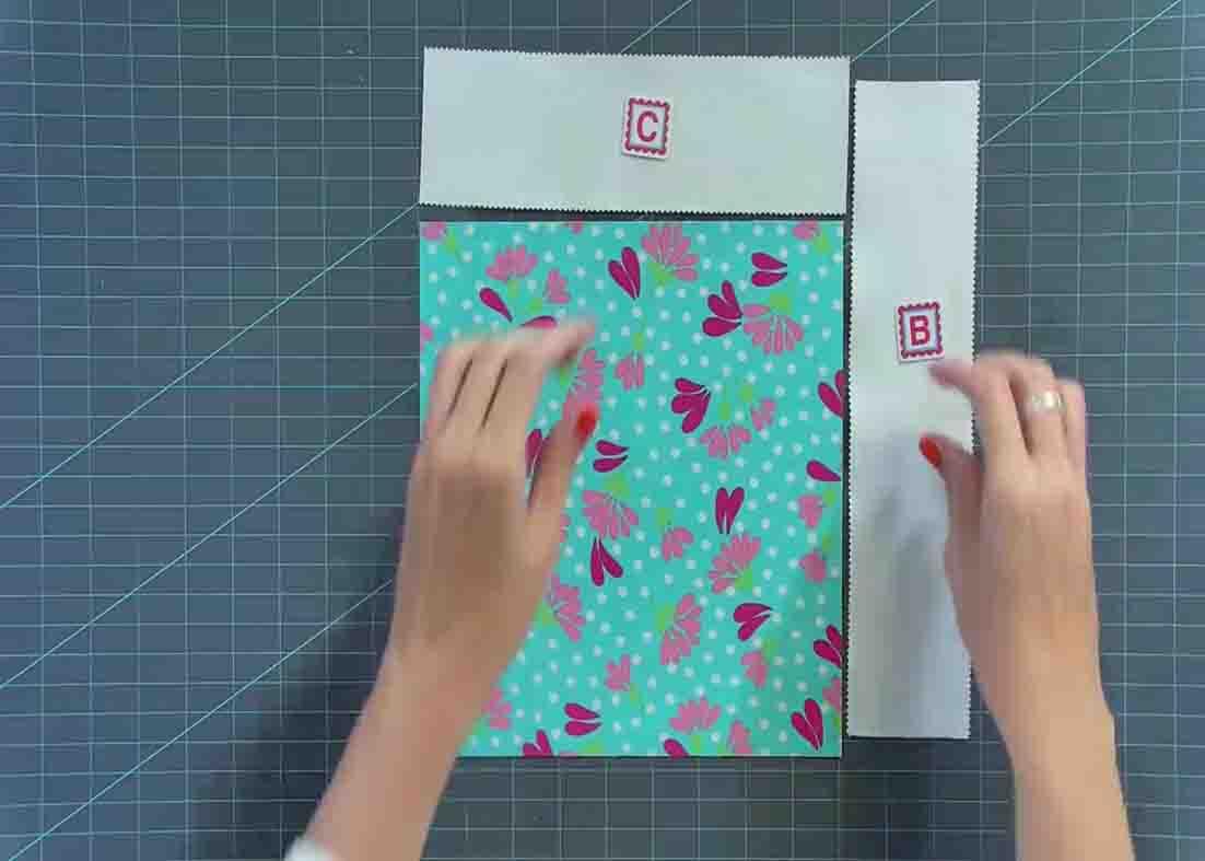 Laying the pieces to make the tumble quilt block