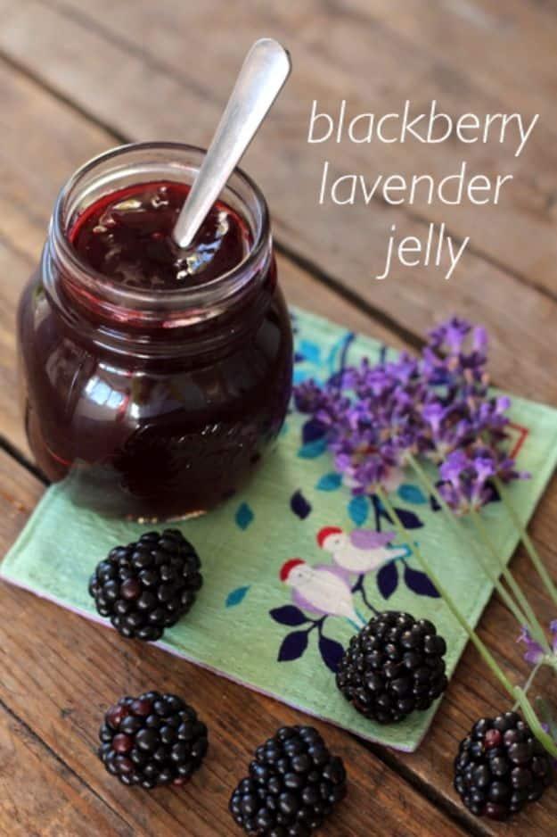 Blackberry lavender jelly in a small jar, deep purple and set, with fresh blackberries and lavender sprigs