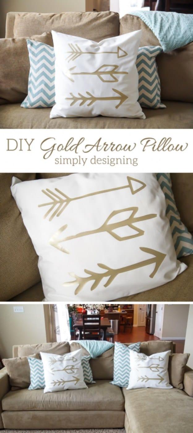 DIY gold arrow pillows, a collage of white throw pillows with metallic gold arrow designs arranged on a tan sofa