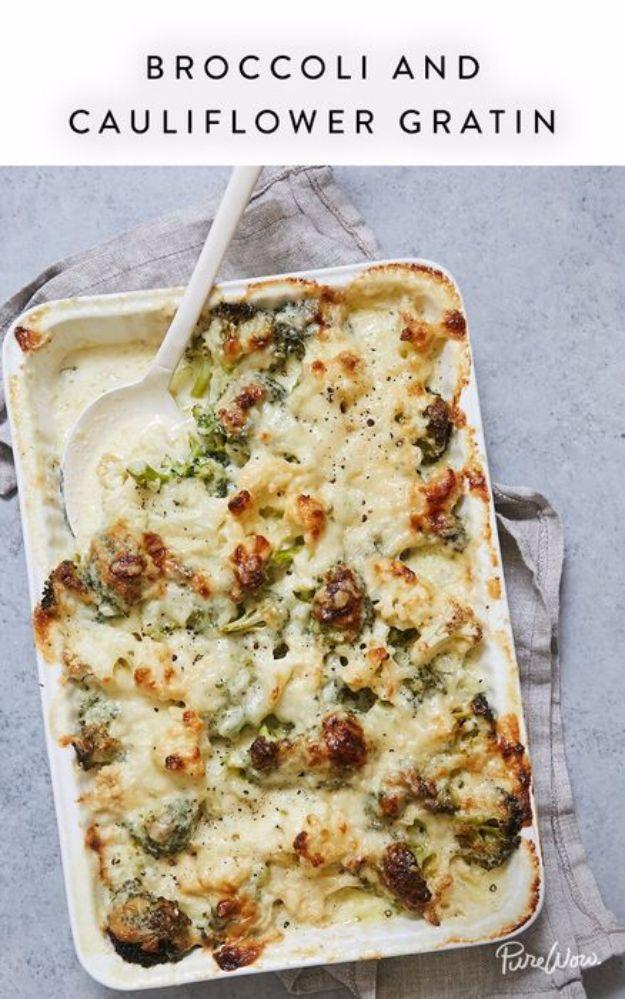 Broccoli and cauliflower gratin bubbling under a browned gruyere and parmesan crust in a white casserole dish