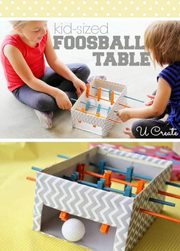 Chevron shoe box foosball table with clothespin players, titled kid sized foosball table, two children playing