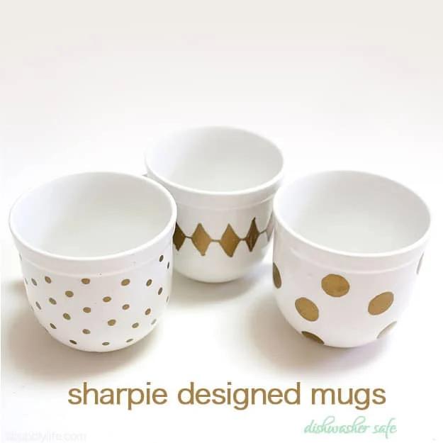 Sharpie Designed Set of Mugs, cheap to pull off with dollar store finds and a piece worth keeping out on display