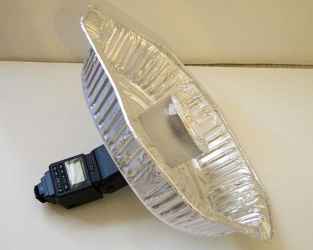 Turkey pan beauty dish, a ridged foil roasting pan mounted on a speedlight that fires back into the dish