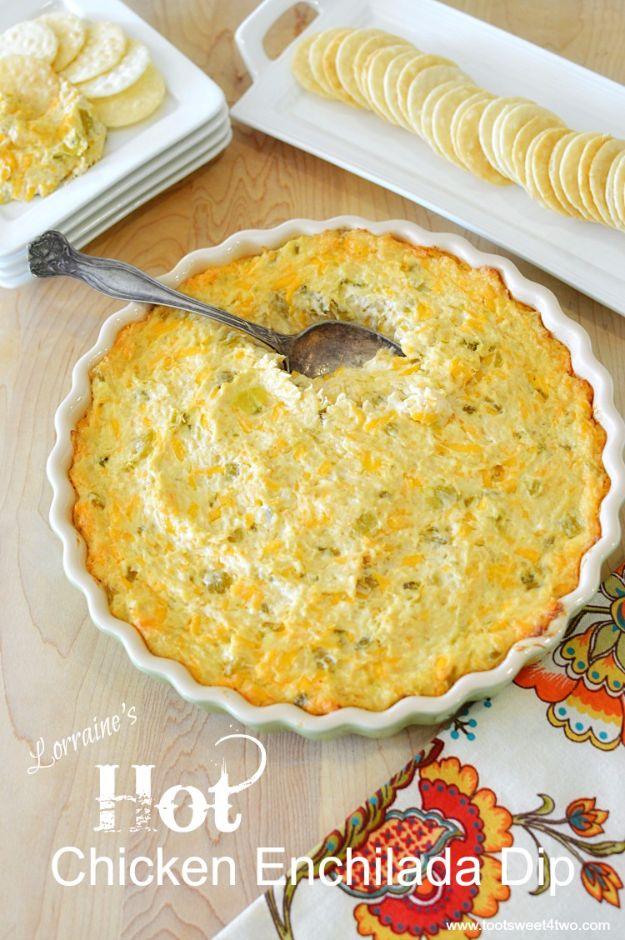 Hot chicken enchilada dip in a baking dish with melted cheese and green chiles through shredded chicken