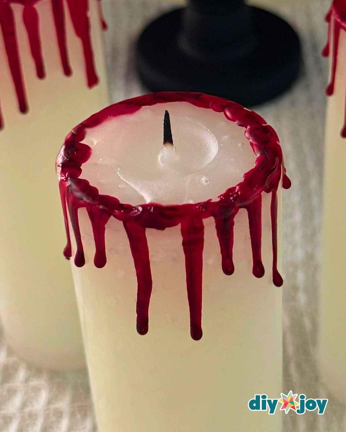 Realistic blood candle made from crayons for a gothic Halloween centerpiece that costs almost nothing to make.