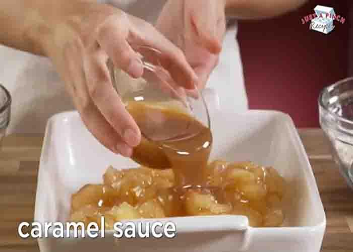 Adding the caramel sauce to the apple pecan dump cake