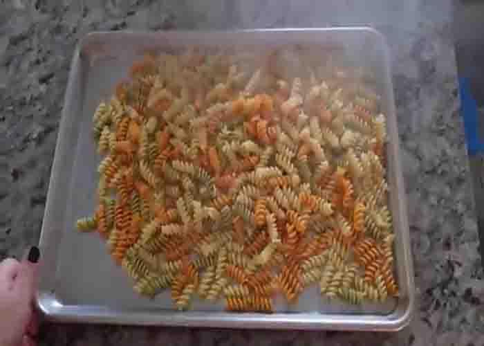 Cooling off the pasta for the party pasta salad
