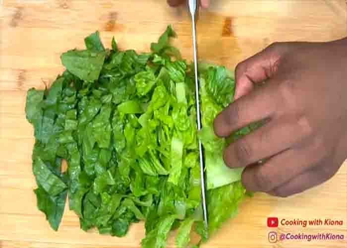 Chopping the lettuce for the caesaroni sandwich