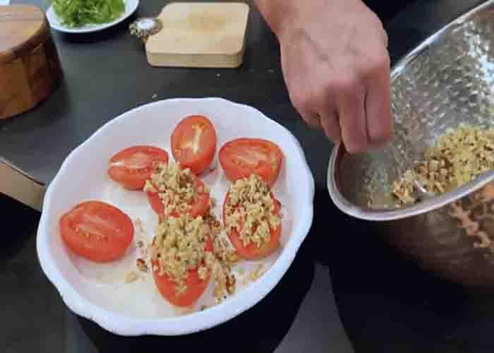 Assembling the lemon-pecan tomatoes