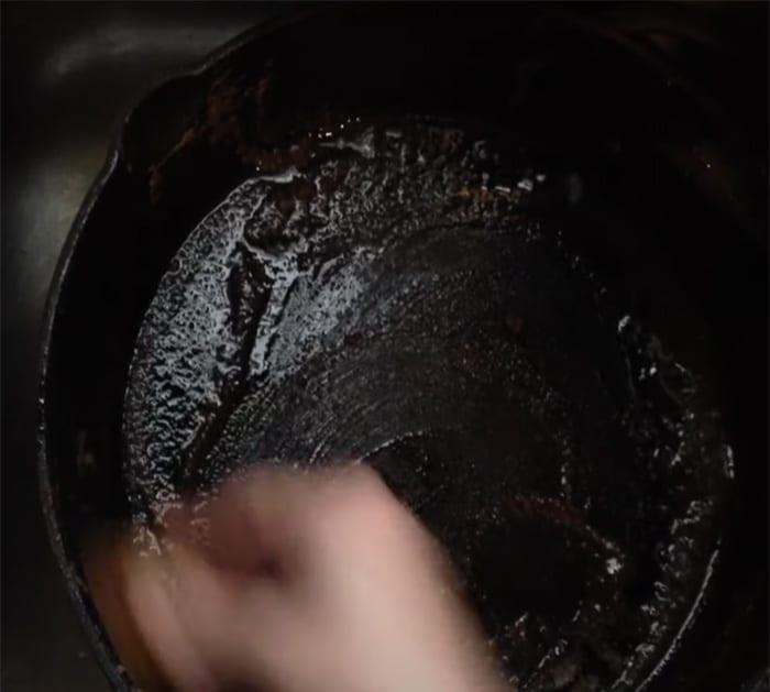 clean rusty cast iron with potato
