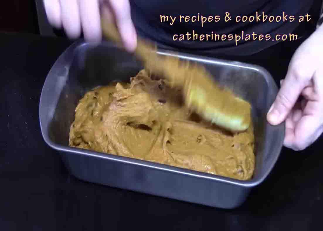 Spreading the pumpkin bread batter to the loaf pan evenly