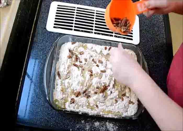 Assembling the pumpkin pie dump cake