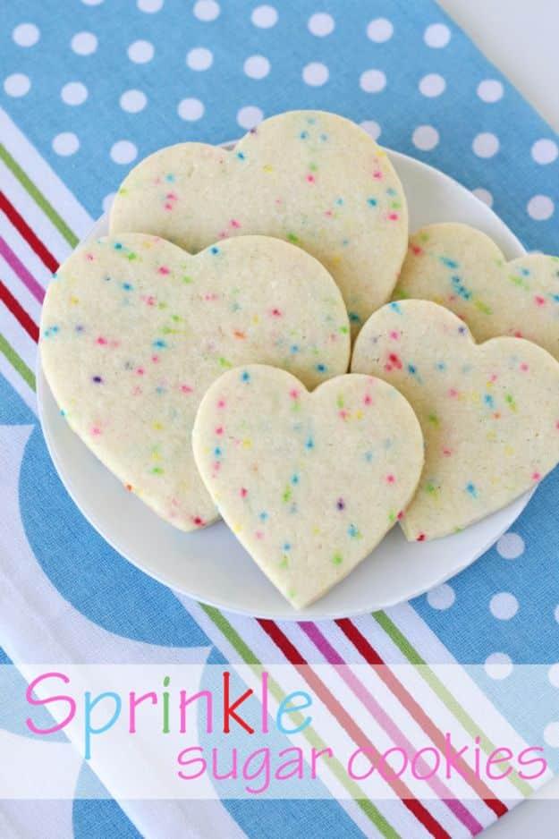 Sprinkle sugar cookies with rainbow non-pareils mixed right through the dough, cut into shapes and baked