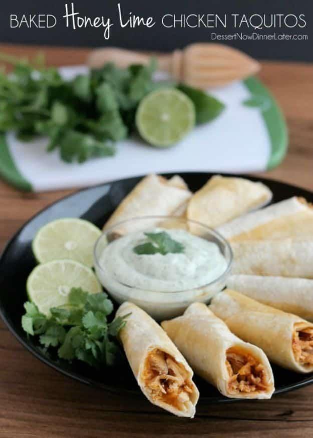 Baked honey lime chicken taquitos on a sheet pan with a bowl of cilantro lime cream for dipping for an easy weeknight dinner