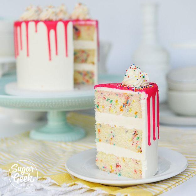 White funfetti cake with a bright pink drip and a slice on a plate showing sprinkle studded layers inside