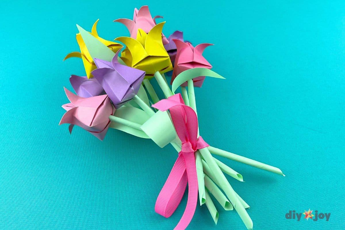 Paper tulip flowers folded from colored paper for a budget friendly gift you can finish in one sitting