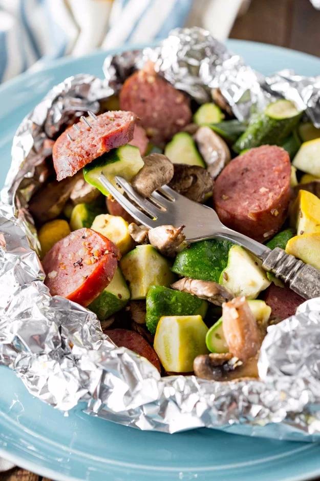 Camping recipe: kielbasa foil packet dinner built for minimal prep time and even less cleanup afterward