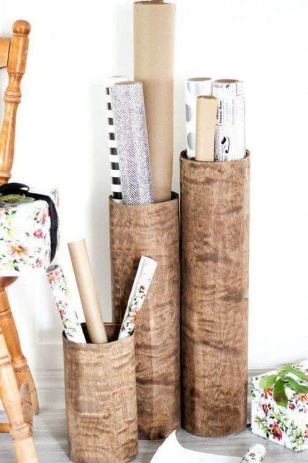Three matching chalk painted canisters with lettered labels stand in a row on a whitewashed pantry shelf