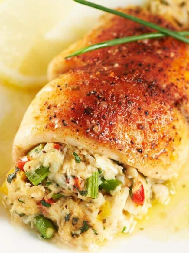Crab and asparagus stuffed tilapia rolls baked in a dish, an elegant stuffed fish recipe for a dinner party