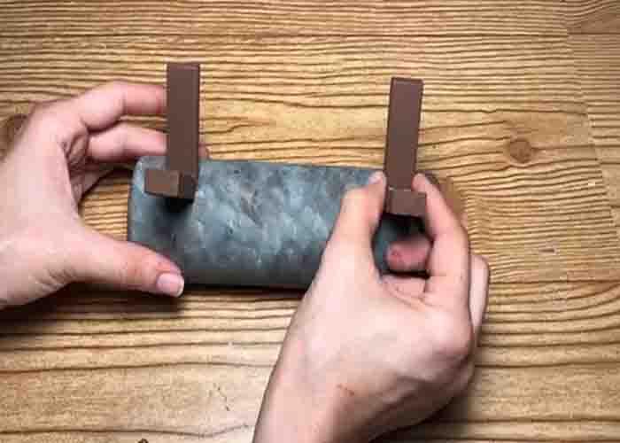 Attaching the stand of the rolling pin succulent planter
