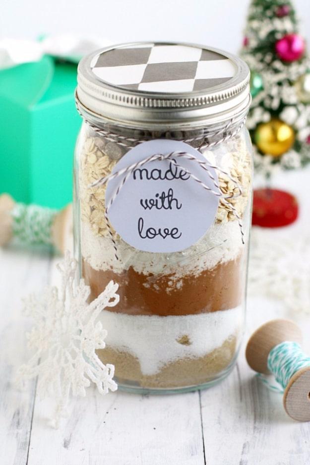 Jar of double chocolate coconut oatmeal cookie mix with a made with love gift tag on a white surface